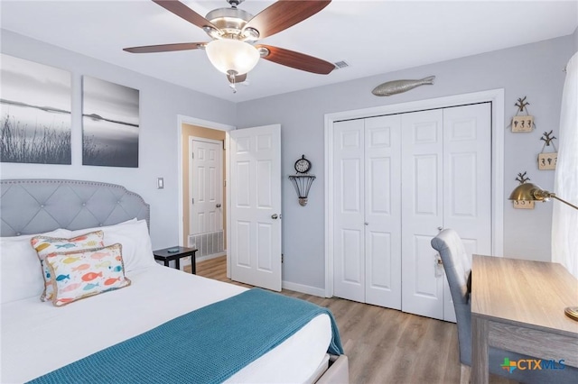 30 Nassau Dr, Rockport, TX 78382 - bedroom featuring a closet, ceiling fan, visible vents, and wood finished floors