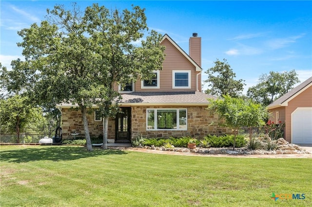 view of front of property with stone siding, fence, a chimney, and a front lawn