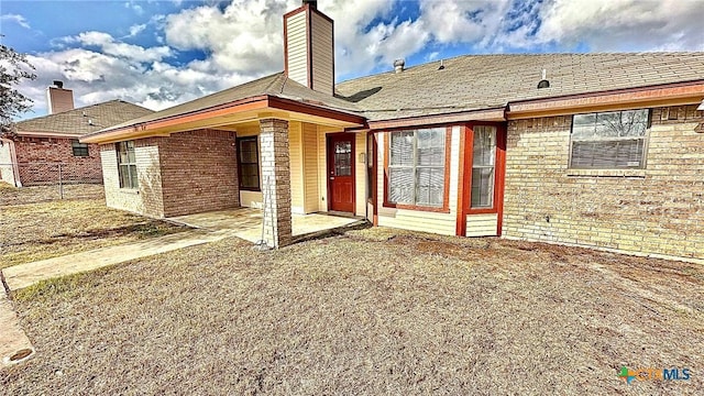 back of house featuring a patio area