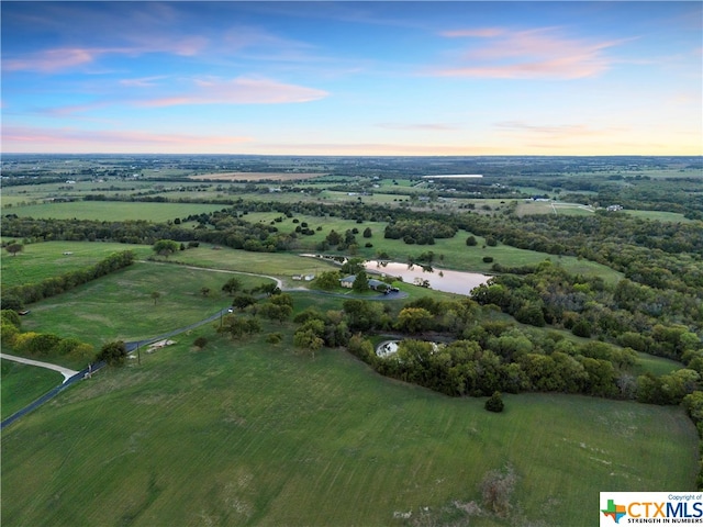 aerial view at dusk with a rural view