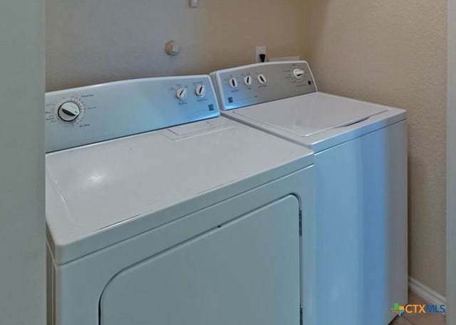 clothes washing area with washer and dryer