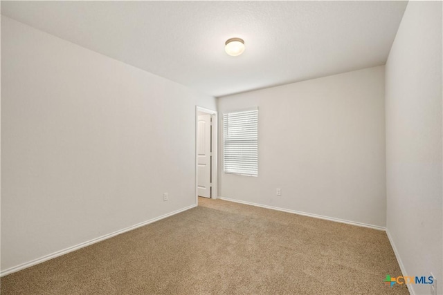 837 Margay Loop, Seguin, TX 78155 - carpeted empty room featuring baseboards