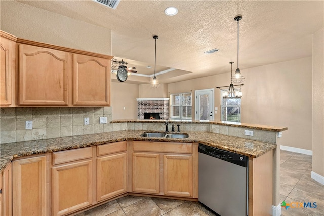 kitchen with sink, dishwasher, a raised ceiling, kitchen peninsula, and light brown cabinets