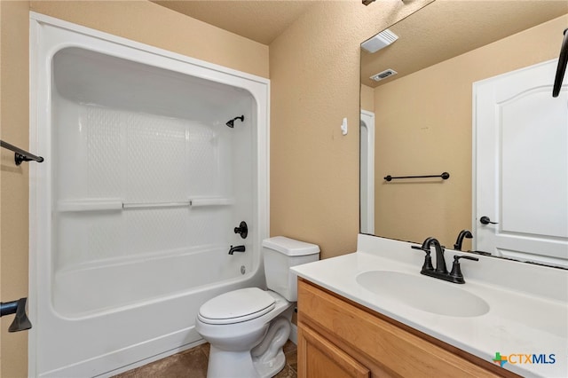 full bathroom featuring vanity, tile patterned floors, toilet, and shower / bath combination