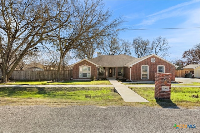 ranch-style home with a front yard