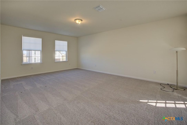 unfurnished room with light colored carpet