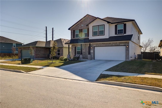 view of front of property with central AC unit, a garage, and a front yard