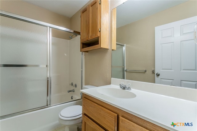 full bathroom featuring vanity, toilet, and enclosed tub / shower combo