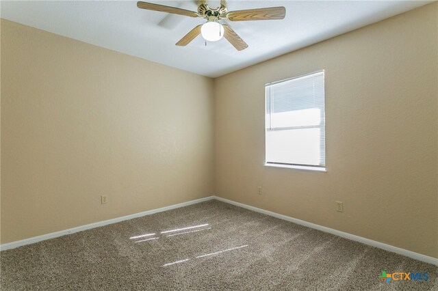 unfurnished room featuring ceiling fan and carpet floors