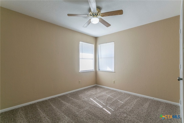 carpeted empty room with ceiling fan