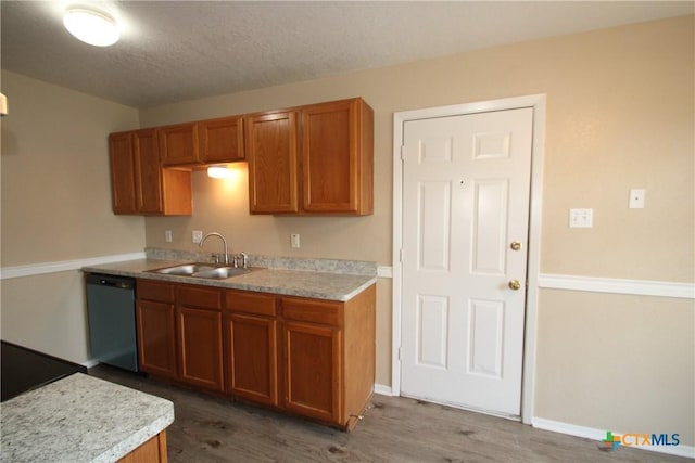 2604 Cross Timber Dr, Killeen, TX 76543 - kitchen featuring dishwasher, brown cabinets, and wood finished floors