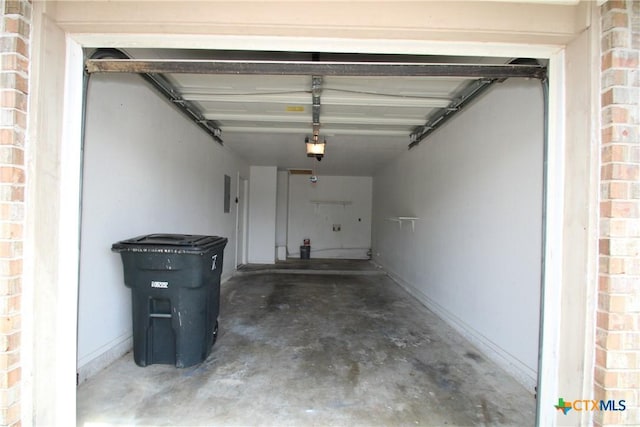 2604 Cross Timber Dr, Killeen, TX 76543 - garage featuring a garage door opener and baseboards