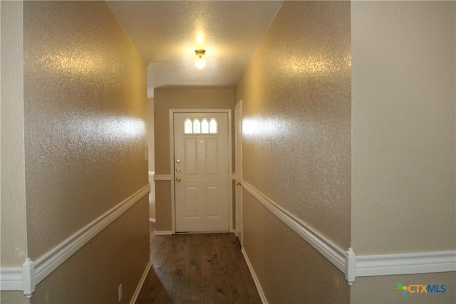 2604 Cross Timber Dr, Killeen, TX 76543 - doorway to outside with wood finished floors and a textured wall