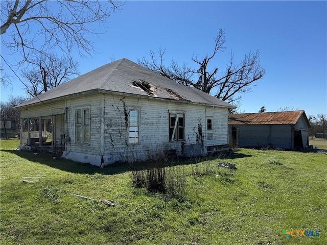 view of home's exterior with a lawn