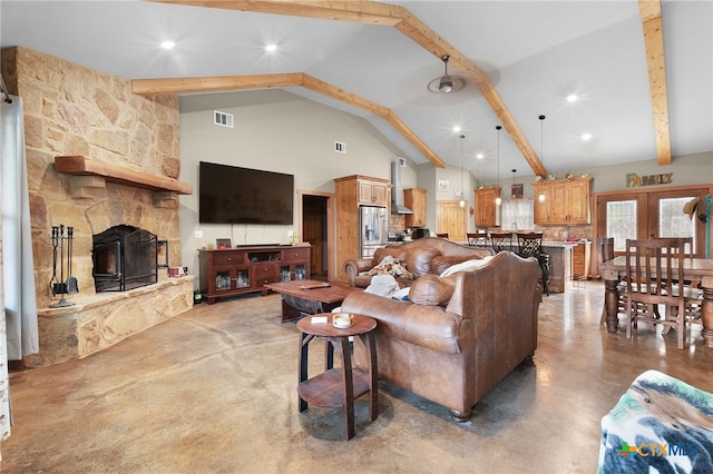 living room with beamed ceiling, high vaulted ceiling, concrete floors, and french doors