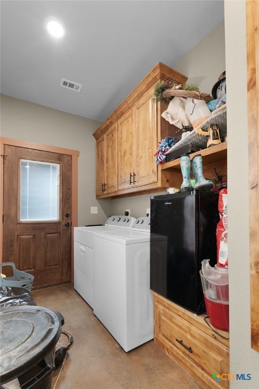 washroom with cabinets and separate washer and dryer