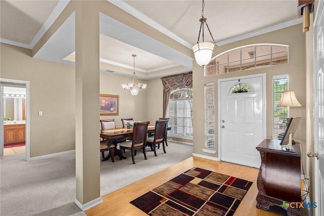 entryway with a wealth of natural light, baseboards, and ornamental molding
