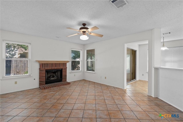 unfurnished living room featuring light tile patterned floors, ceiling fan, and visible vents