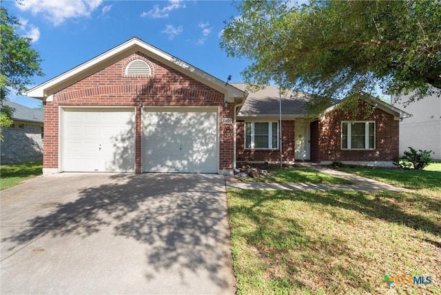 ranch-style house featuring a garage, driveway, a front lawn, and brick siding