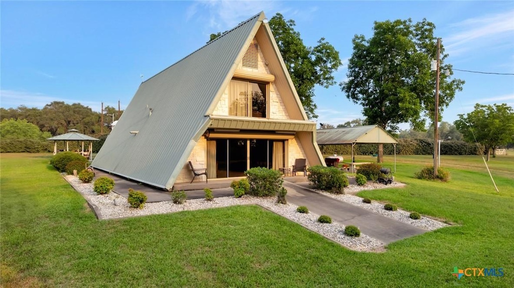 79 W Albrecht Rd, Victoria, TX 77905 - back of house with metal roof, a yard, and a gazebo