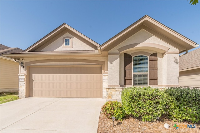 ranch-style home featuring a garage