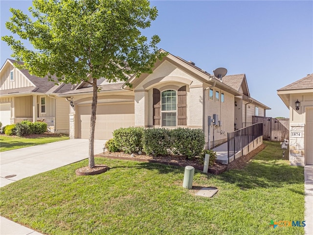 view of front of house with a garage and a front lawn