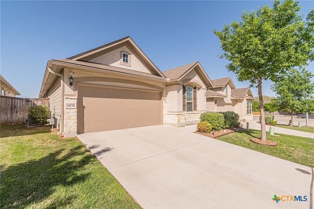 view of front of home with a front lawn and a garage