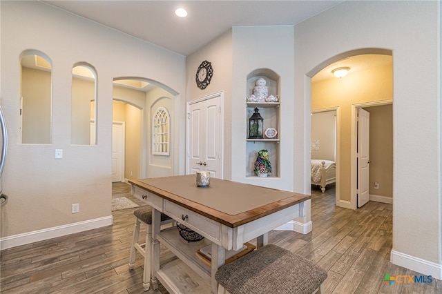 dining space featuring dark hardwood / wood-style floors