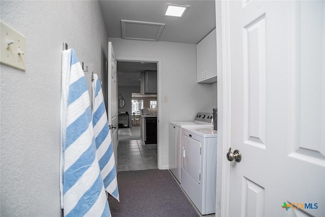 laundry area featuring cabinets and separate washer and dryer