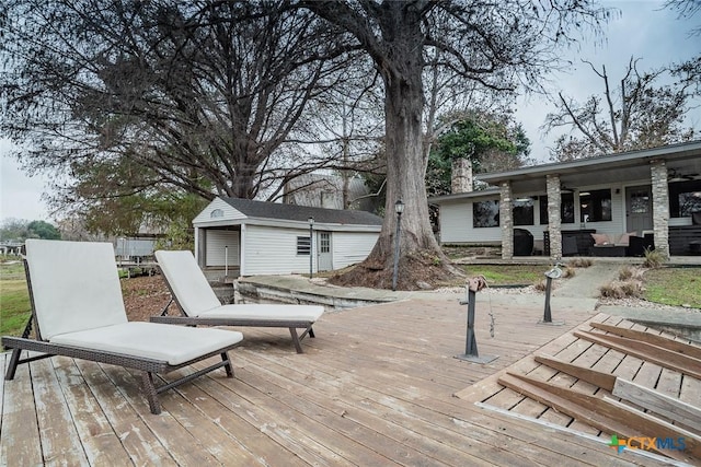 deck featuring an outbuilding