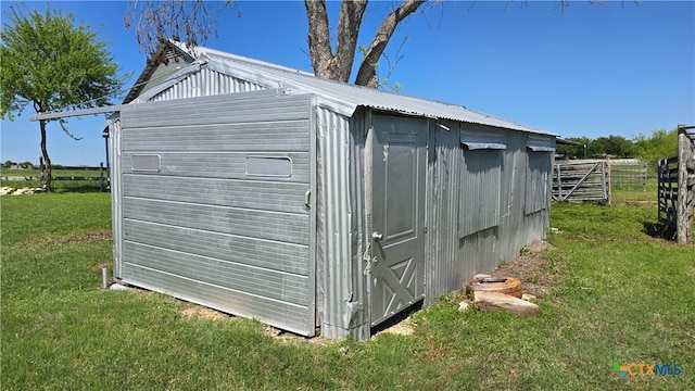 view of shed featuring fence