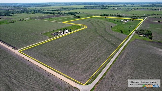 birds eye view of property featuring a rural view