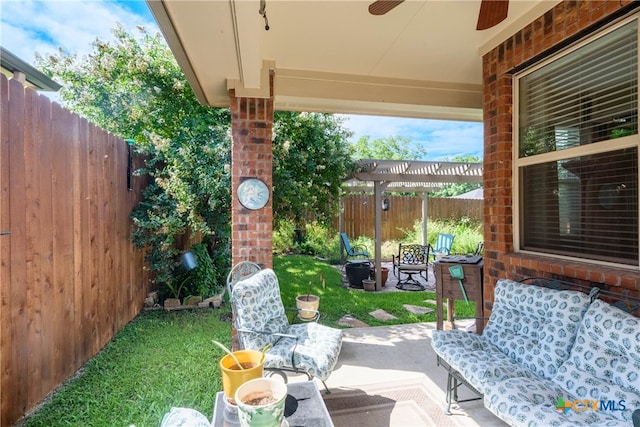 view of patio / terrace featuring a pergola, an outdoor fire pit, and ceiling fan