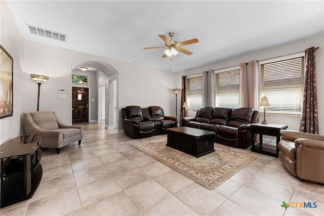 tiled living room featuring ceiling fan