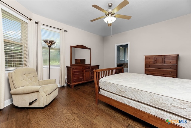 bedroom with dark hardwood / wood-style flooring and ceiling fan