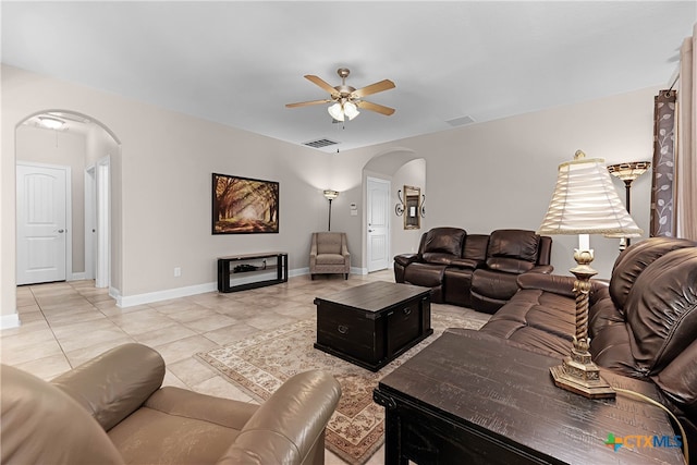 living room with light tile patterned floors and ceiling fan