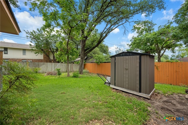 3909 Alderwood Ln, Temple, TX 76502 - view of yard featuring a storage unit and an outbuilding