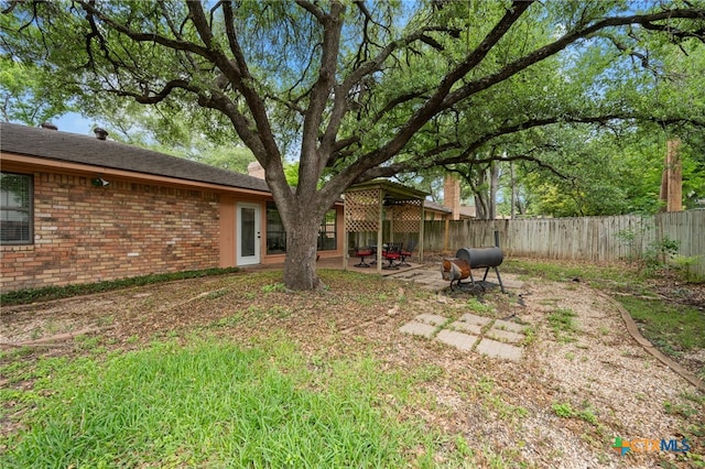 3909 Alderwood Ln, Temple, TX 76502 - fenced backyard with a patio area