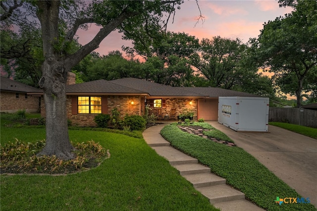 3909 Alderwood Ln, Temple, TX 76502 - view of front of home featuring driveway, brick siding, and a chimney