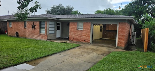 3207 Linda Dr, Victoria, TX 77901 - view of front of property featuring brick siding, concrete driveway, and a front lawn