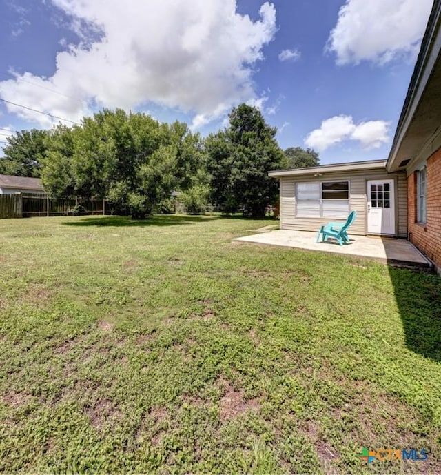 3207 Linda Dr, Victoria, TX 77901 - view of green lawn with a patio area