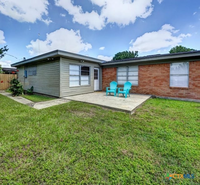 3207 Linda Dr, Victoria, TX 77901 - rear view of house with a patio and brick siding