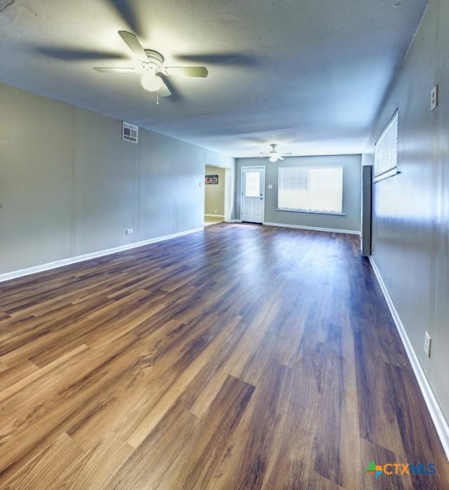 3207 Linda Dr, Victoria, TX 77901 - unfurnished living room featuring a ceiling fan and wood finished floors