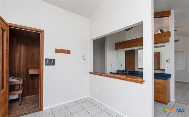 525 Teague Dr, Moody, TX 76557 - kitchen featuring lofted ceiling, light tile patterned floors, and baseboards