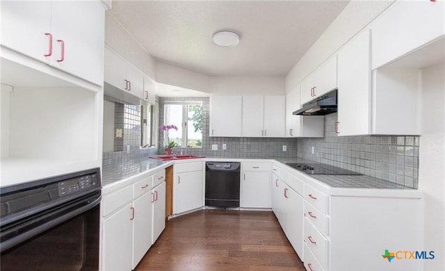 525 Teague Dr, Moody, TX 76557 - kitchen featuring black appliances, under cabinet range hood, a sink, light countertops, and dark wood-type flooring