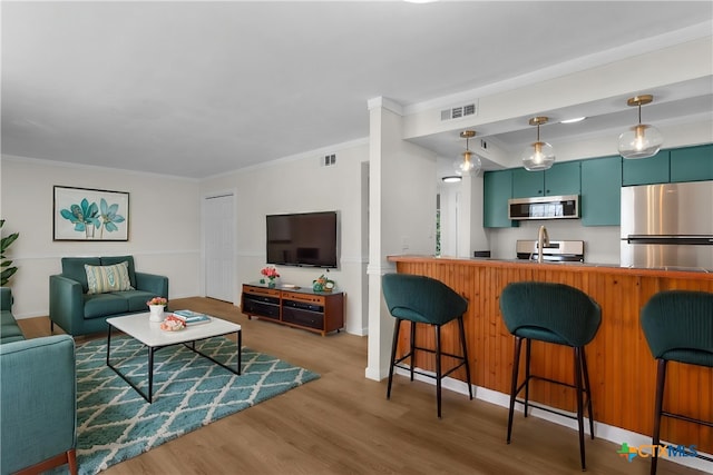 7801 Shoal Creek Blvd Unit 240, Austin, TX 78757 - living room with wood finished floors and ornamental molding
