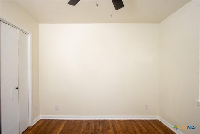 1004 Estes Dr, Killeen, TX 76541 - unfurnished bedroom featuring baseboards, dark wood-type flooring, and a closet
