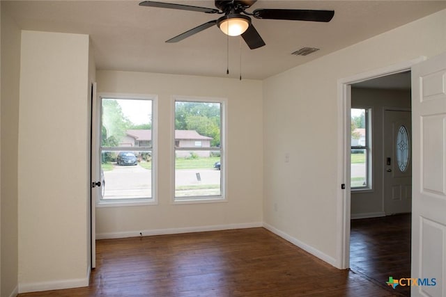 1004 Estes Dr, Killeen, TX 76541 - spare room with a ceiling fan, visible vents, dark wood-style flooring, and baseboards