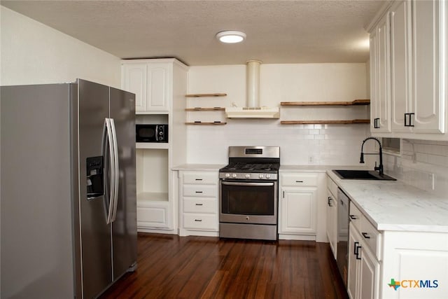 1004 Estes Dr, Killeen, TX 76541 - kitchen with open shelves, a sink, stainless steel appliances, dark wood-style floors, and range hood