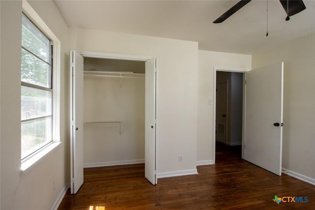 1004 Estes Dr, Killeen, TX 76541 - unfurnished bedroom with wood finished floors, a closet, and multiple windows